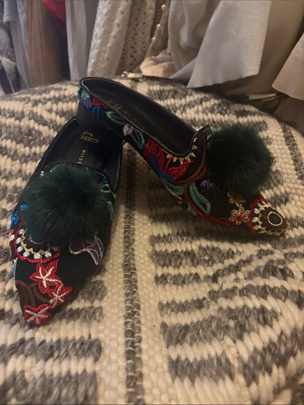 Embroidered Black Pointed-Toe Pom Pom Flats